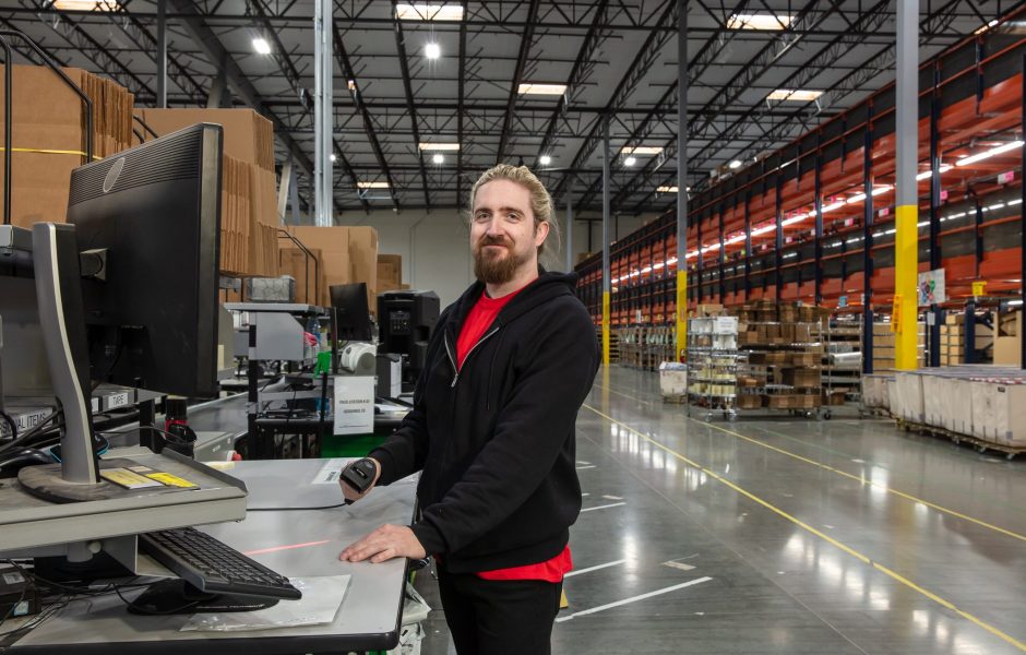 worker processing an order in an ecommerce fulfillment center