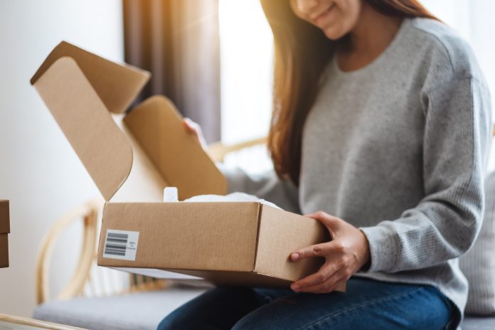 happy woman opening a package